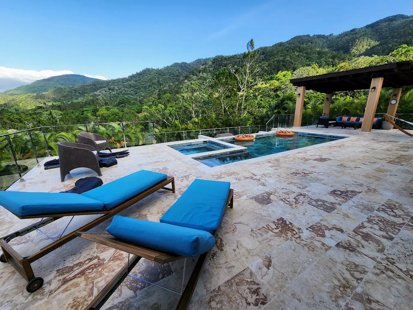 Sun loungers by the pool and jacuzzi