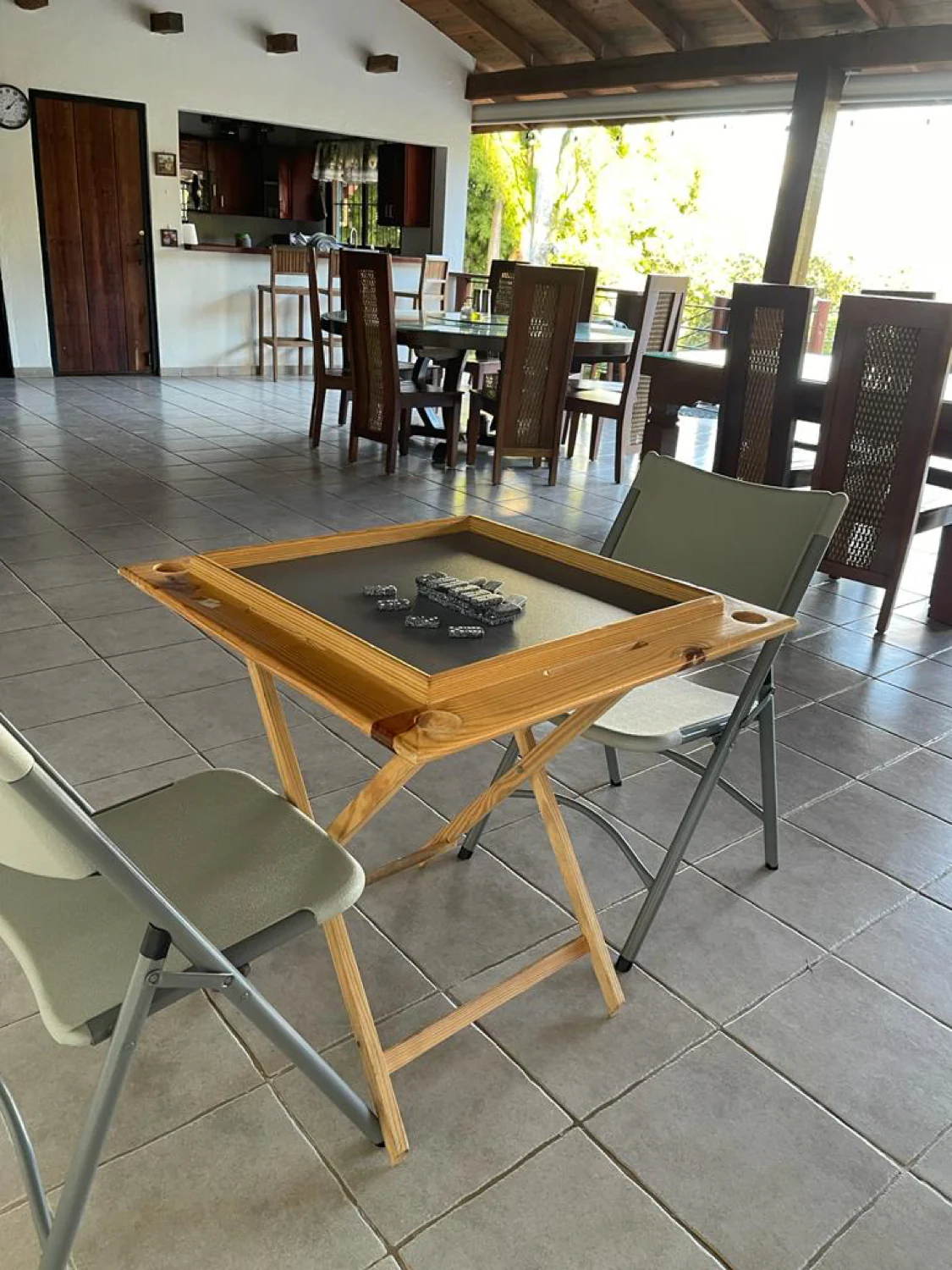 A domino table set up by the dining area