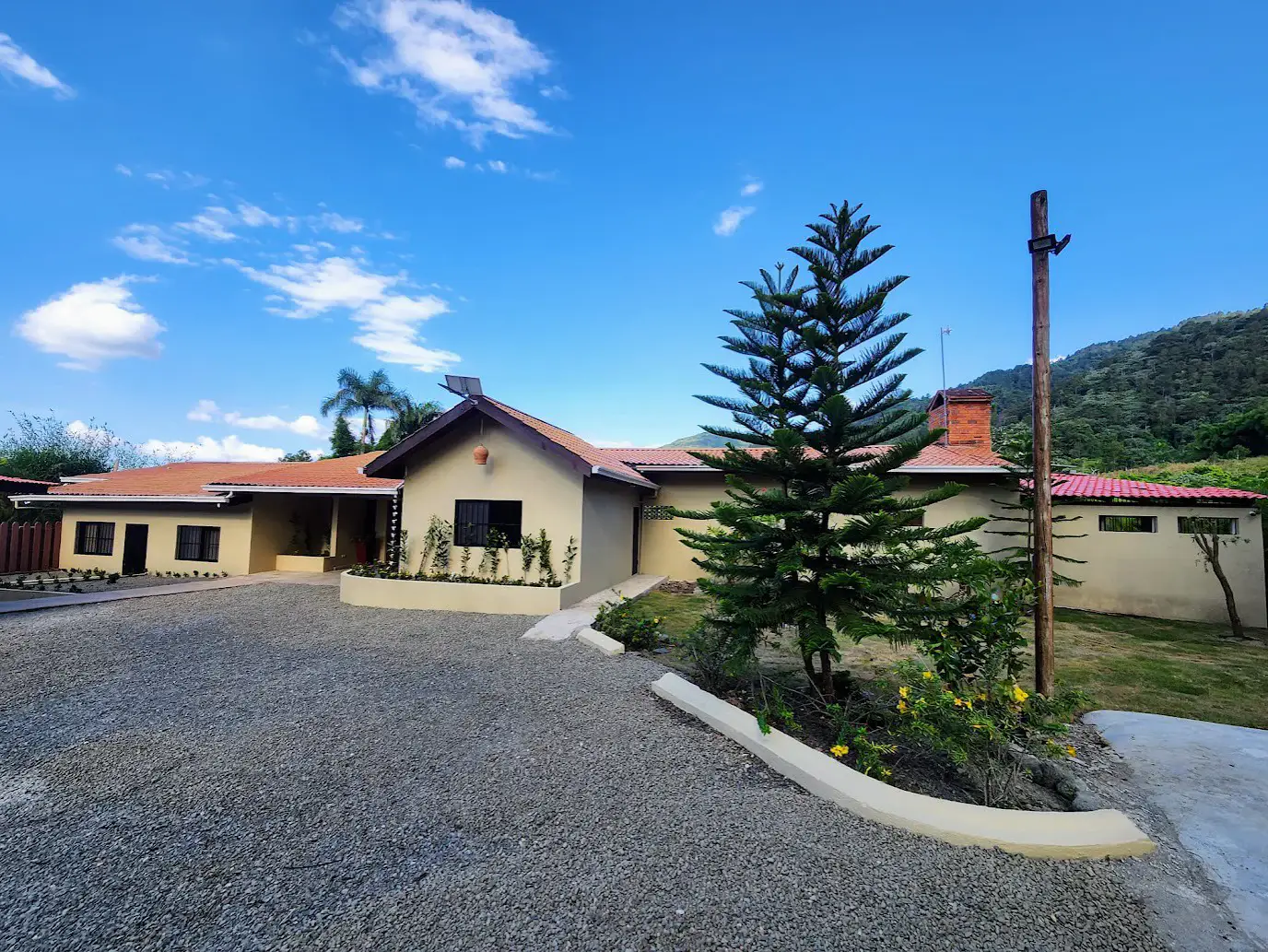 The villa framed by mountain pines