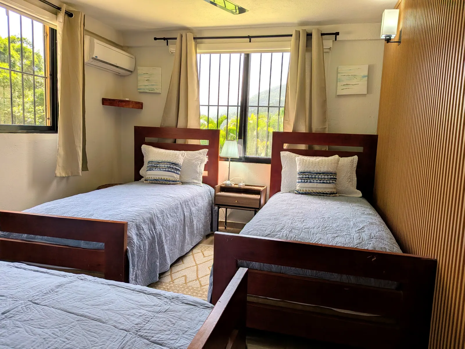 The Parrot Suite — three single beds with mountain views