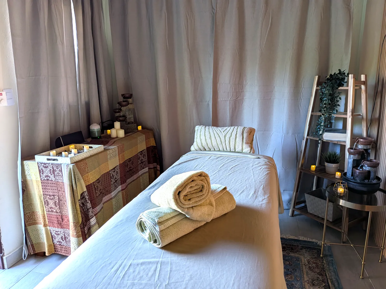 The candle-lit massage room